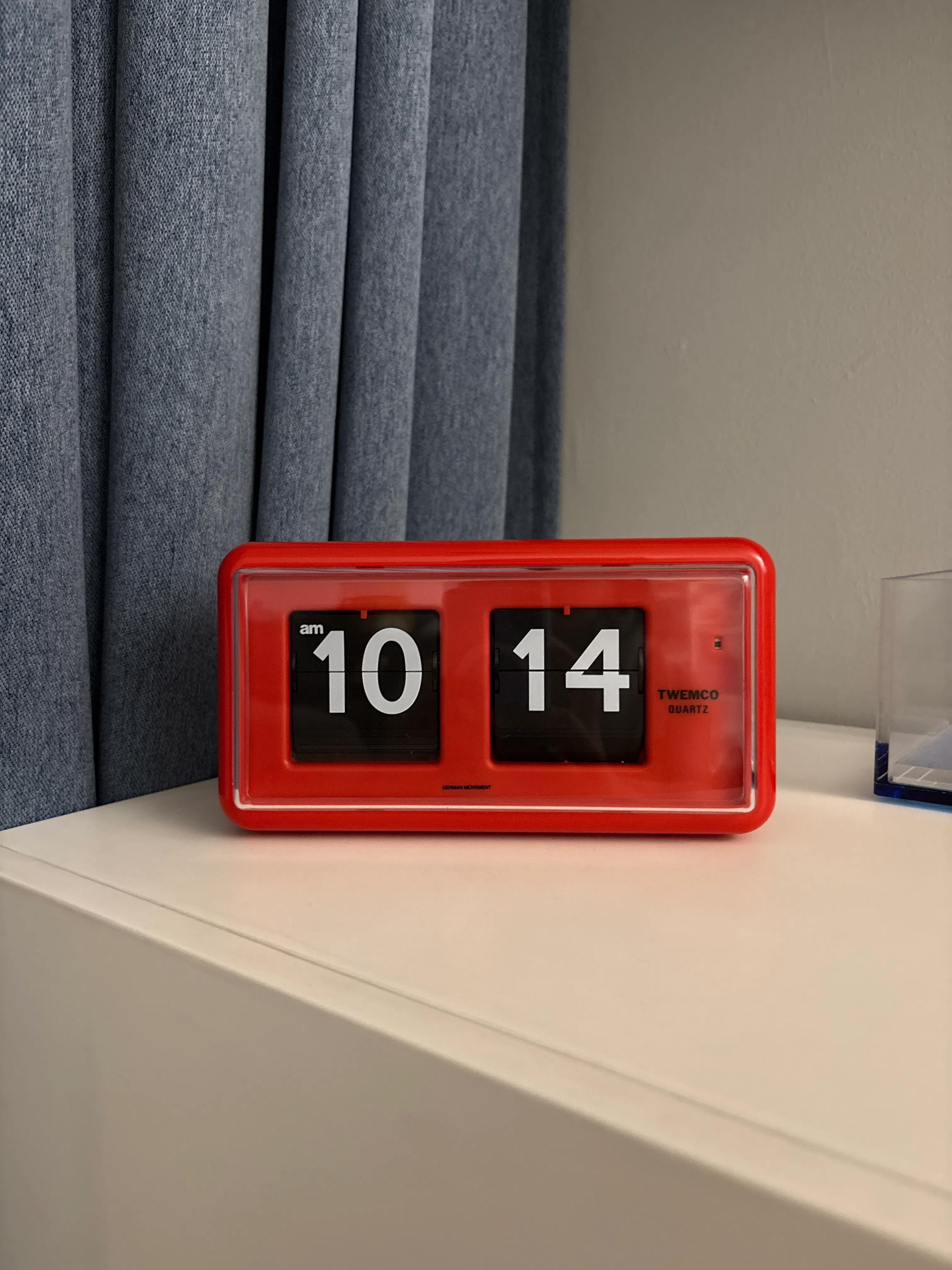 Customer home photo 8: THE  iconic clock many homeowners have been raving about - we love how it looks in our home! The design is simple but somehow also really versatile as well and looks great almost anywhere, from the tv console to our study room. Comes with battery included! But the battery is wrapped up so you’ll have to remove the plastic and pop it back in :)