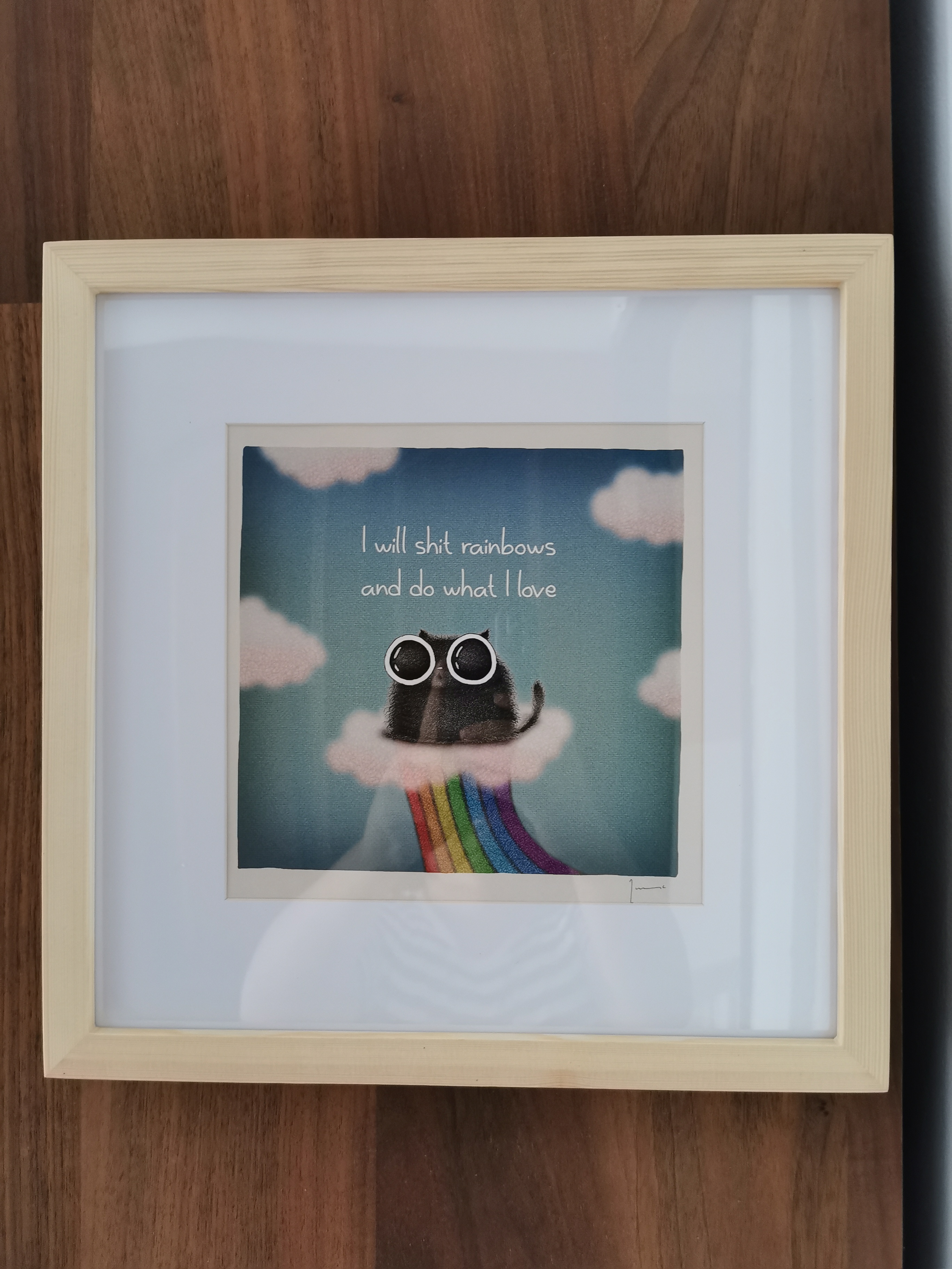 Customer home photo 7: Perfect frame for a print I bought recently. I like the unfinished wood colour and it's acrylic, not glass. It's not heavy and it gives that piece of mind using a pasted on picture holder inside of nails.