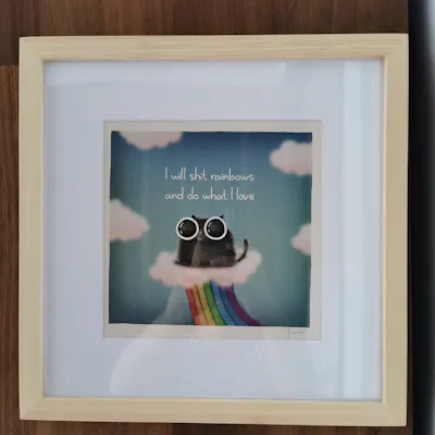 Customer home photo 7: Perfect frame for a print I bought recently. I like the unfinished wood colour and it's acrylic, not glass. It's not heavy and it gives that piece of mind using a pasted on picture holder inside of nails.