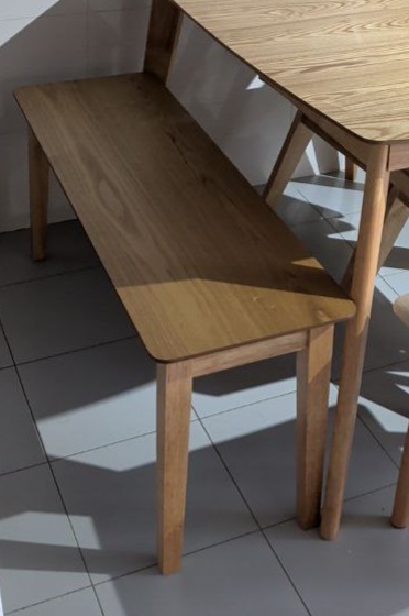 Customer home photo 2: The bench is sturdy comfortable and fits nicely withe dinning set