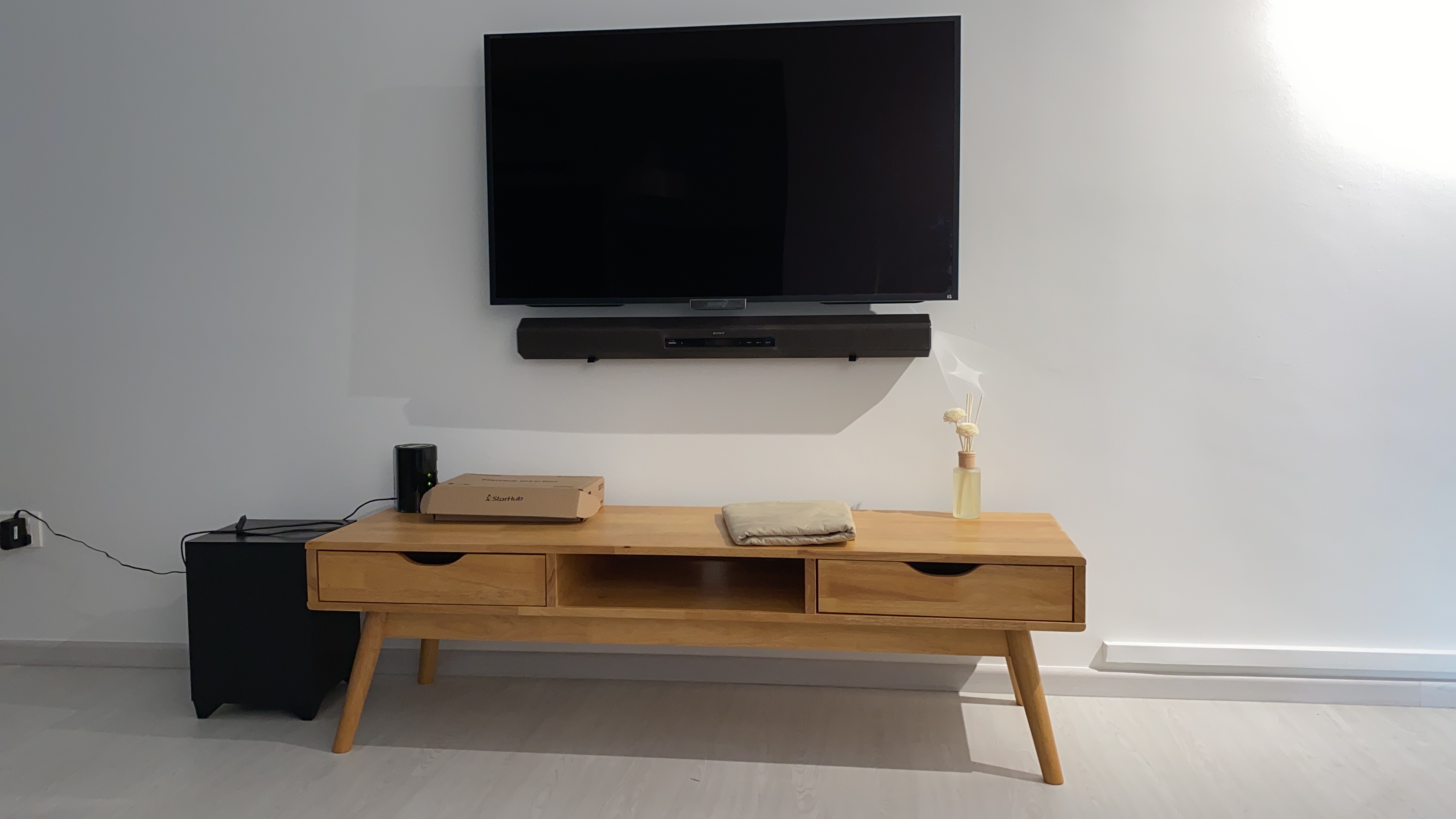 Customer home photo 1: The TV console is sturdy and fit to my home theme. Thank you.