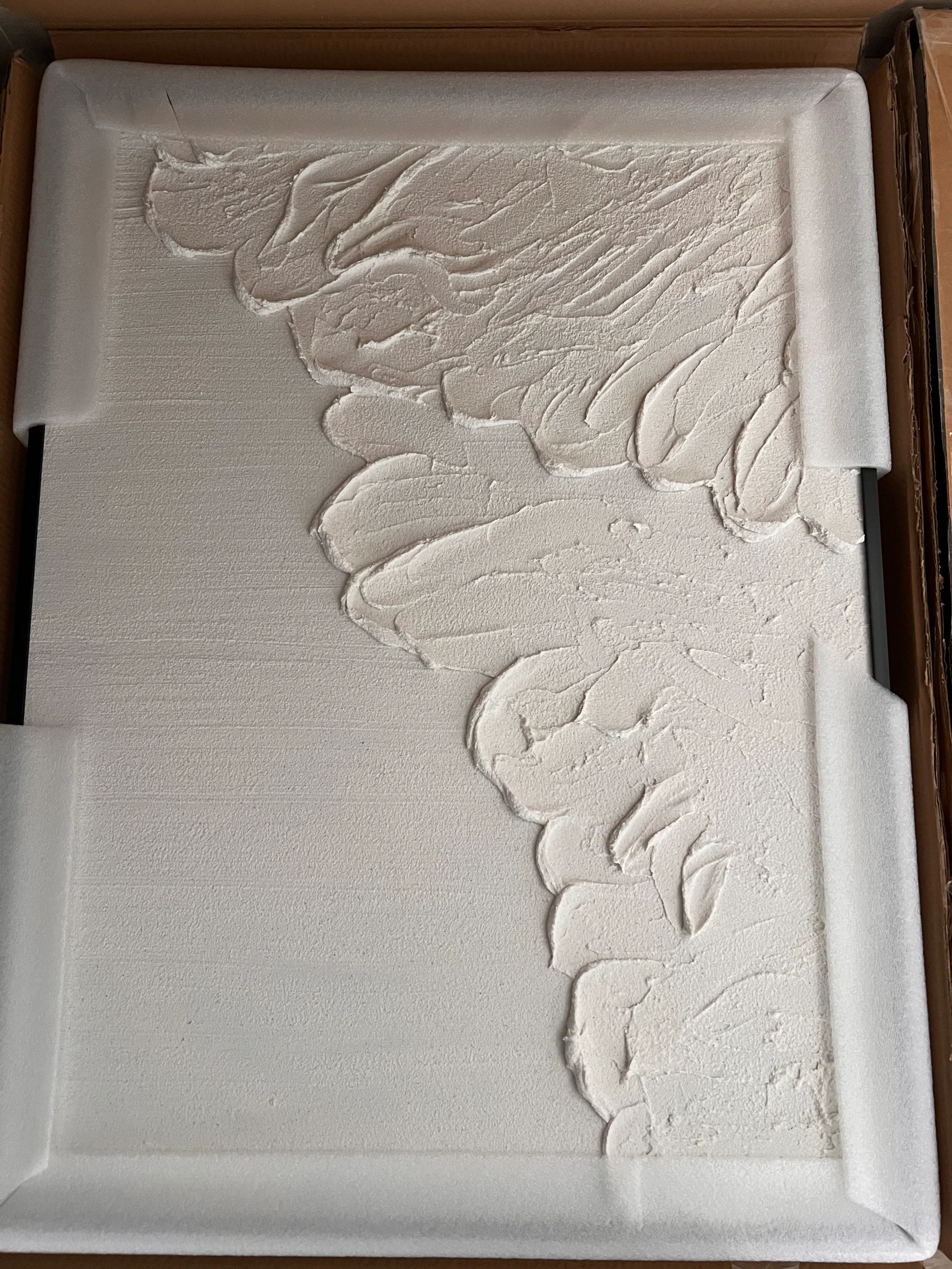 Customer home photo 1: Love the waves! Item came in with guards and delivered safely. Have yet to hang on the wall as my house is still undergoing renovation.