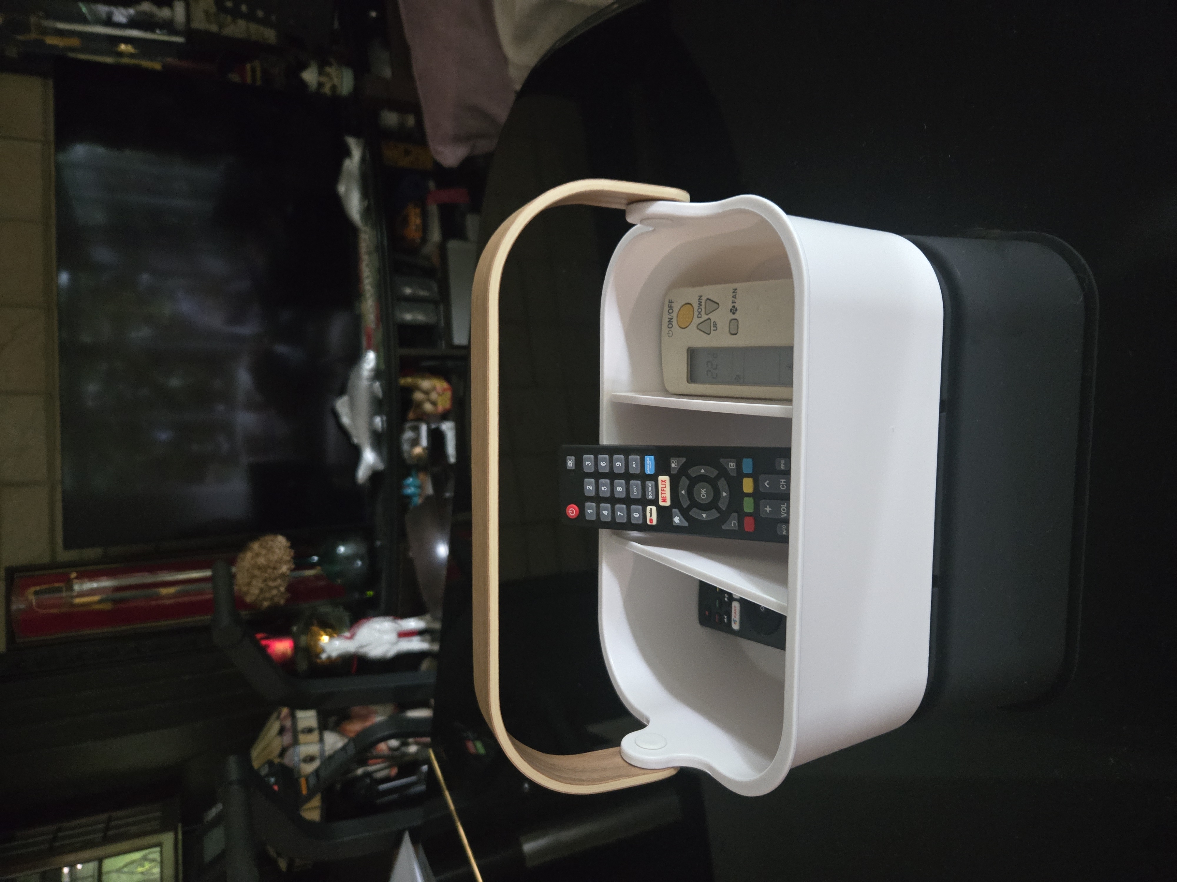 Customer home photo 1: Very practical. No more searching all over the place looking for a remote control. The white colour stands out and it looks classy.