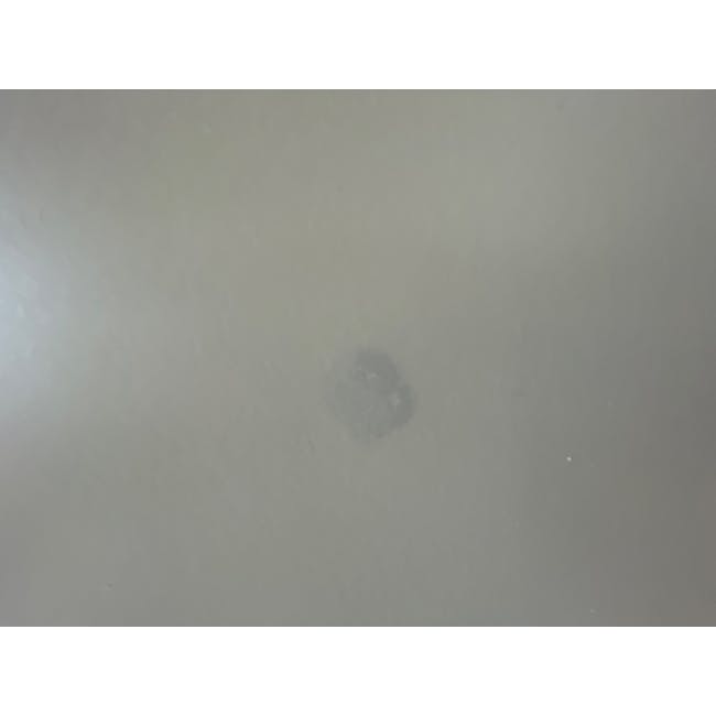 (As-is) Brexley Coffee Table - 4 - Grayish wall with faint shadow, Diffuse lighting on a smooth surface, Minimalistic design