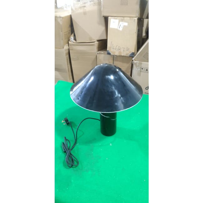 (As-is) Klari Table Lamp - Black - 3 - Sleek, black dome-shaped lamp on green surface, Industrial-style lamp with reflective