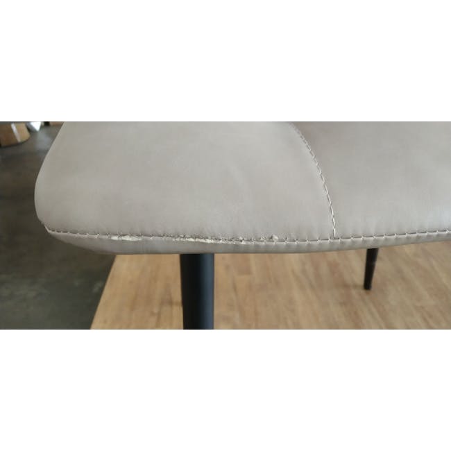 (As-is) Friska Dining Chair - Taupe (Faux Leather) - 3 - Leather chair with visible damage, light gray upholstery, black