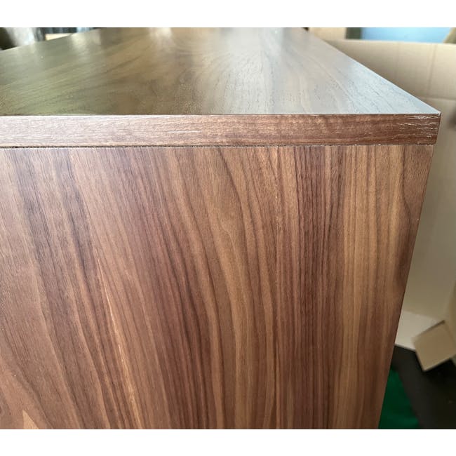 (As-is) Herta Tall Sideboard 1.2m - Walnut - 1 - 9 - Wooden surface with visible grain patterns, smooth finish, natural wood